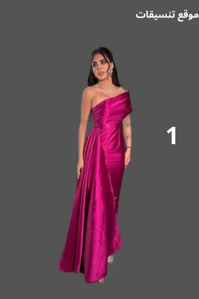 صورة فستان سهرة فوشي طويل مصنوع من قماش الساتان اللامع بتصميم كتف واحد (One Shoulder) وقصة درابية تبرز الخصر.